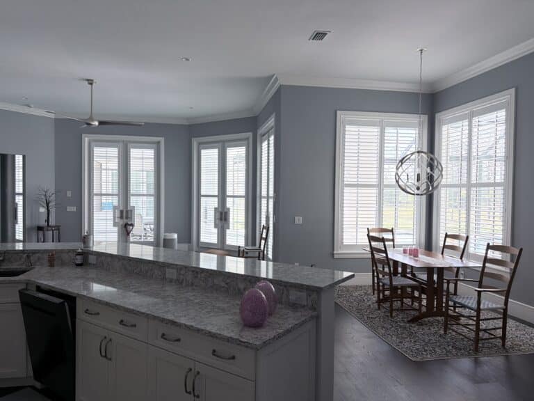 White plantation shutters on french doors and windows in a Lake Highlands, Dallas kitchen and dining area